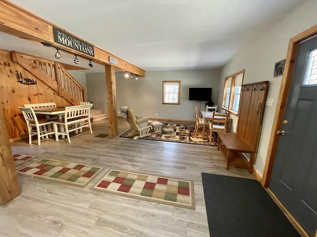 interior space featuring stairway, baseboards, and wood finished floors