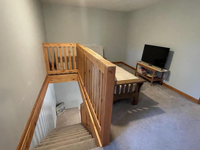 interior space with baseboards and carpet