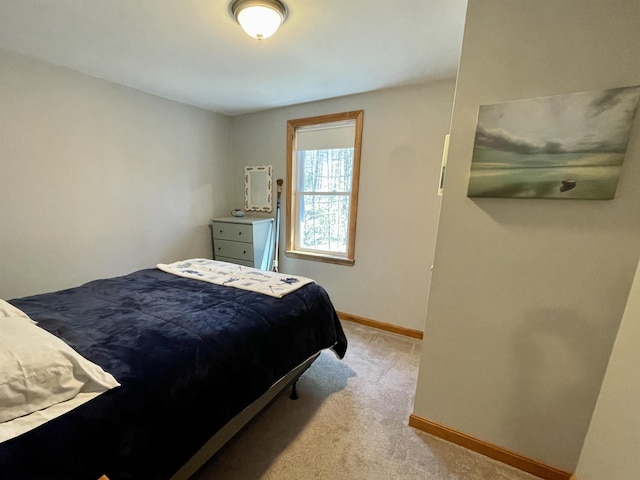 bedroom with baseboards and carpet flooring