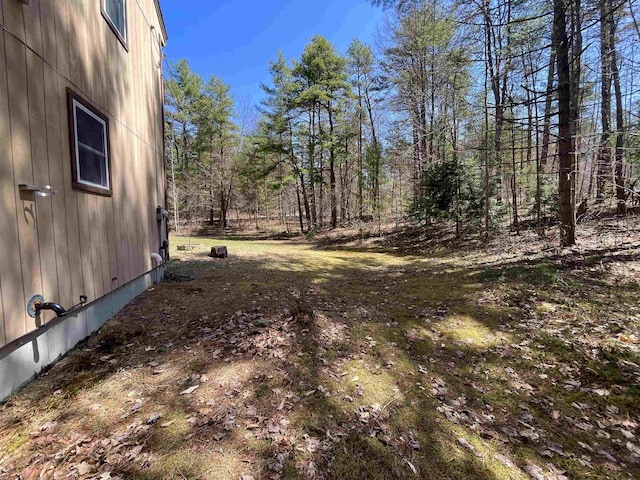 view of yard featuring a wooded view