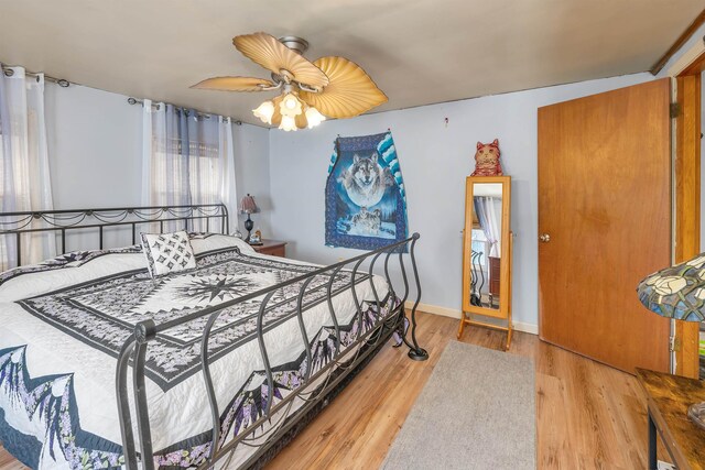 134 Peverly Rd, Northfield, NH 03276 - bedroom with baseboards, a ceiling fan, and wood finished floors