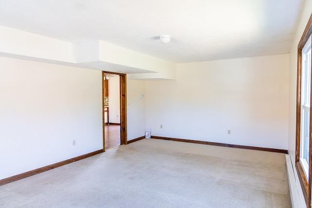 empty room with carpet floors and baseboards
