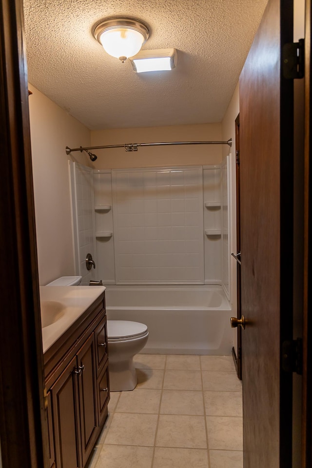 full bath with tile patterned flooring, vanity, toilet, a textured ceiling, and tub / shower combination