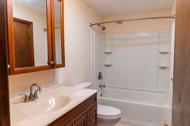 bathroom with vanity, shower / bathing tub combination, and toilet