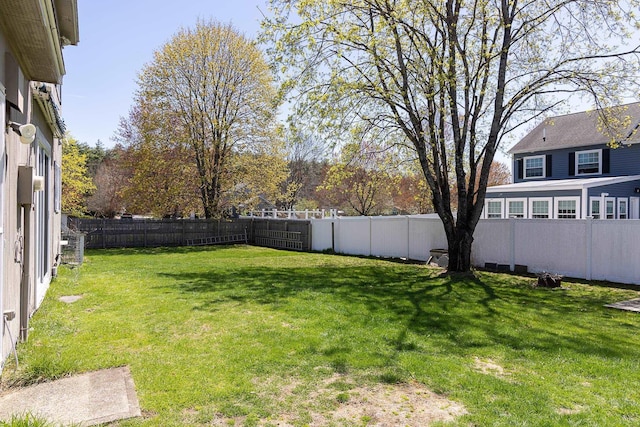 view of yard with a fenced backyard
