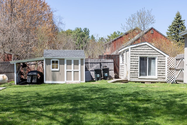 view of shed with a fenced backyard