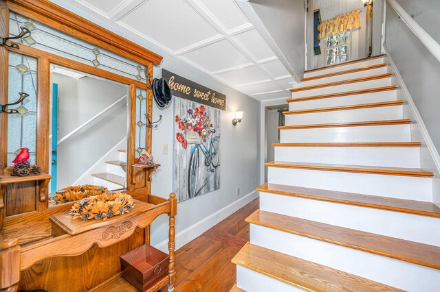 stairs with baseboards and hardwood / wood-style floors