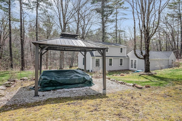 exterior space with a gazebo and french doors