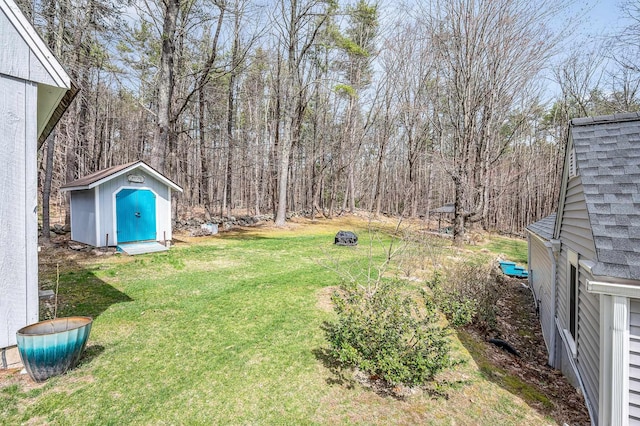 view of yard with a storage unit and an outdoor structure