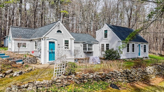 view of front of property with a shingled roof