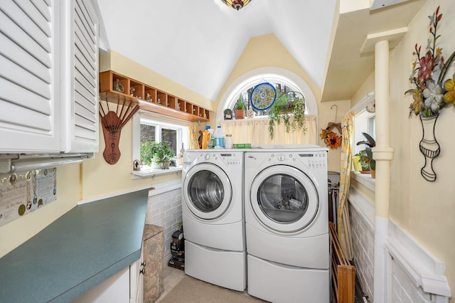 laundry room with plenty of natural light and washer and clothes dryer