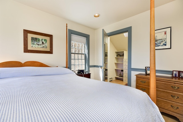 bedroom featuring a baseboard radiator and recessed lighting