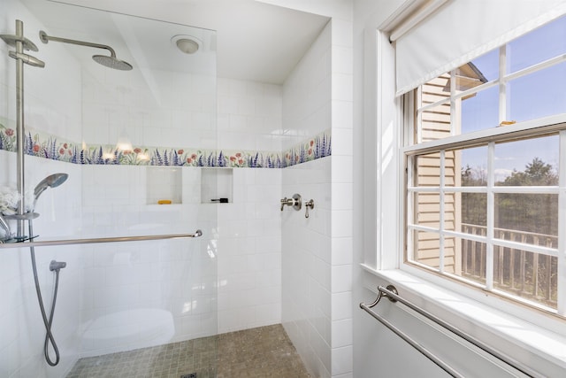 full bathroom featuring a tile shower