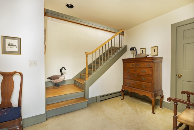 staircase with carpet flooring and baseboard heating