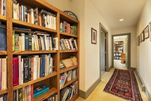 corridor with carpet floors, recessed lighting, and a baseboard radiator