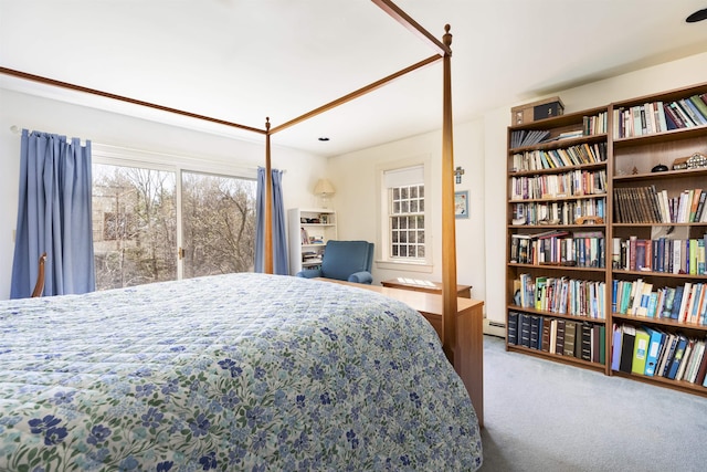 carpeted bedroom with baseboard heating