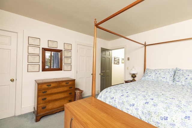 bedroom featuring light colored carpet