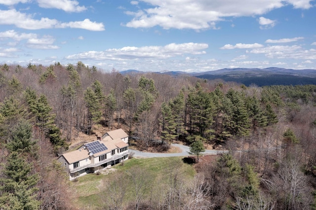 bird's eye view featuring a view of trees and a mountain view