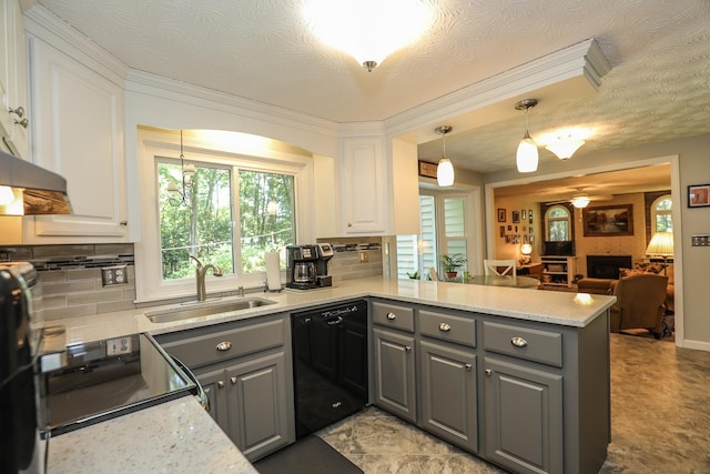 kitchen with a sink, gray cabinets, a peninsula, and dishwasher