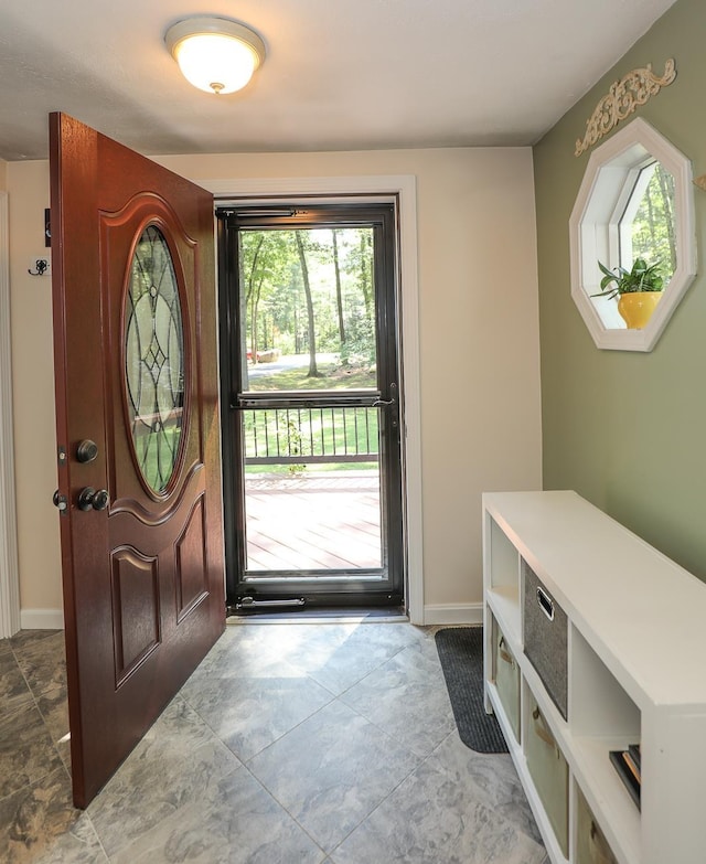 foyer entrance with baseboards