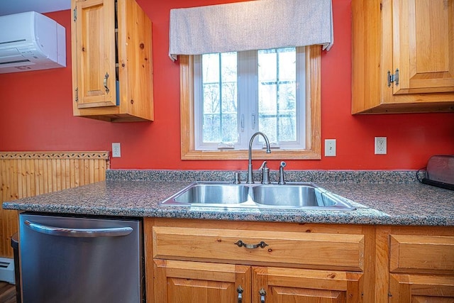 kitchen featuring stainless steel dishwasher, exhaust hood, dark countertops, and a sink
