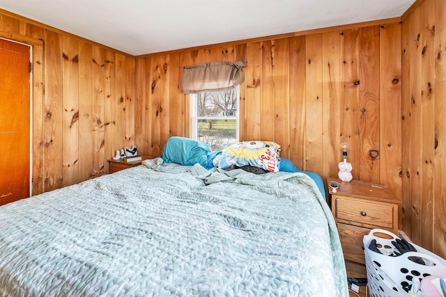 bedroom with wooden walls