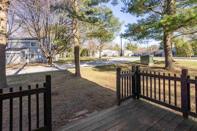 wooden terrace with a residential view