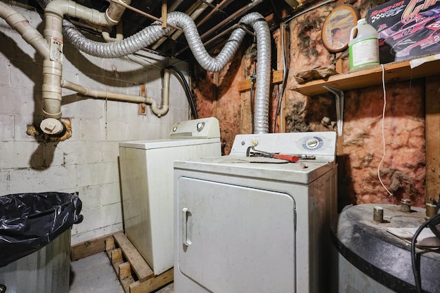 washroom featuring laundry area and washing machine and clothes dryer