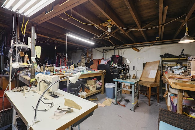 unfinished basement featuring a workshop area