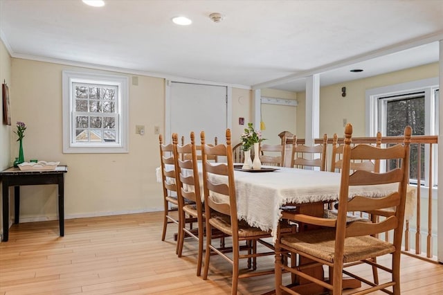 dining room featuring recessed lighting, baseboards, and light wood-type flooring