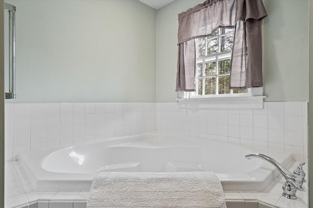 bathroom with a garden tub