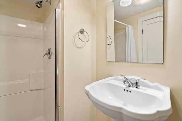 full bath featuring a sink and a stall shower