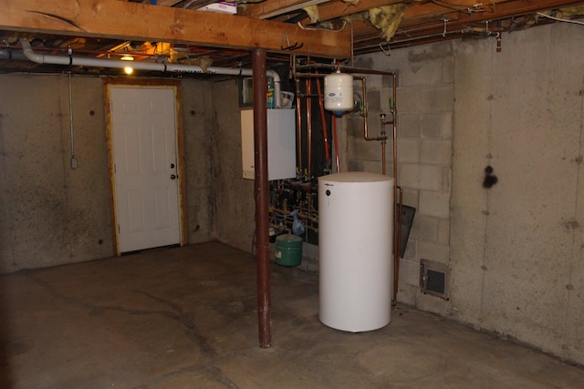 unfinished below grade area featuring gas water heater