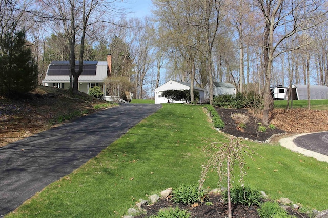 view of road with aphalt driveway