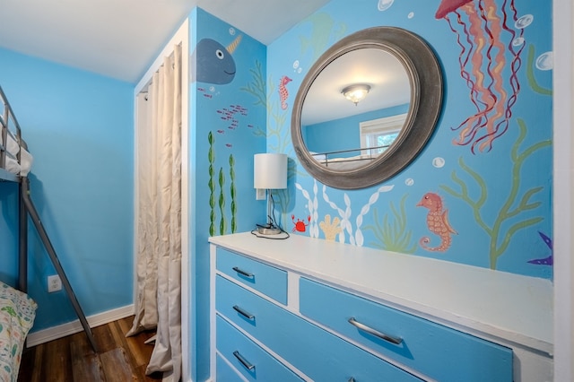 bathroom featuring baseboards and wood finished floors