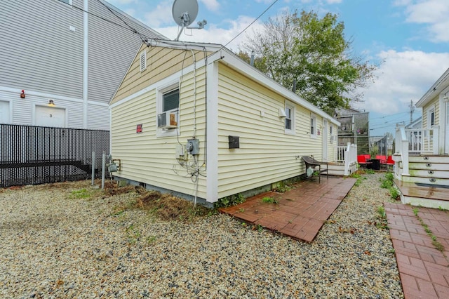 back of property with a patio area and a deck