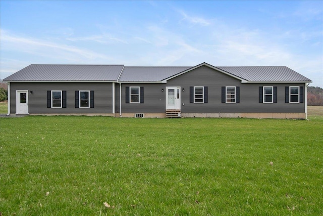 single story home featuring metal roof, a front yard, and entry steps