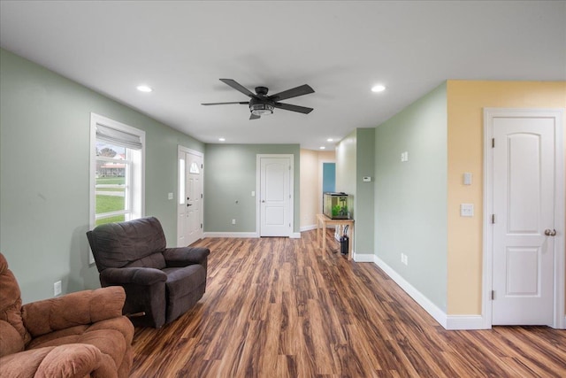 living room featuring baseboards, recessed lighting, ceiling fan, and wood finished floors
