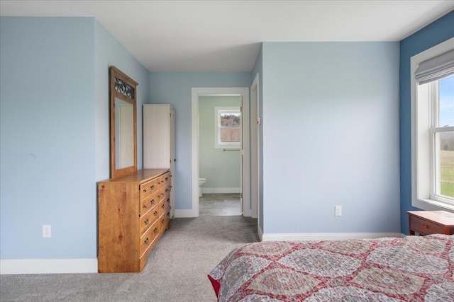 carpeted bedroom with baseboards