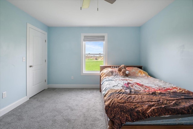 bedroom featuring carpet flooring, baseboards, and ceiling fan