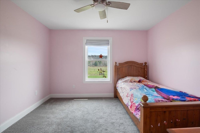 bedroom featuring baseboards, carpet, and a ceiling fan
