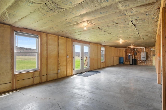 interior space featuring concrete floors and water heater