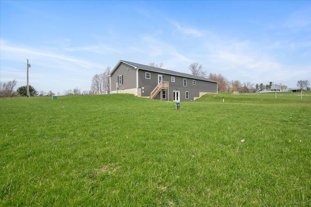 back of house with a yard