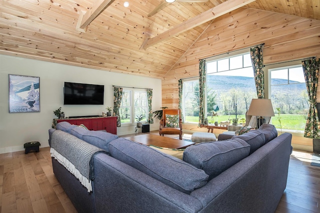 living room with wooden ceiling, high vaulted ceiling, and plenty of natural light