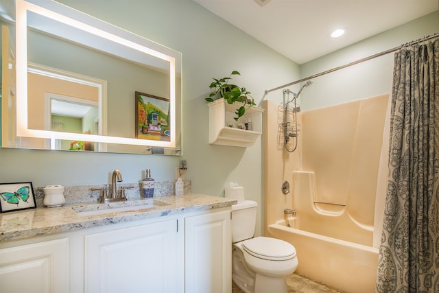 bathroom featuring toilet, shower / bath combination with curtain, and vanity