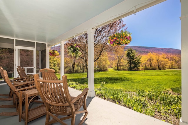 view of patio with a view of trees
