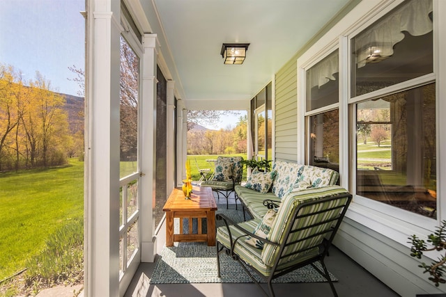 sunroom with a mountain view