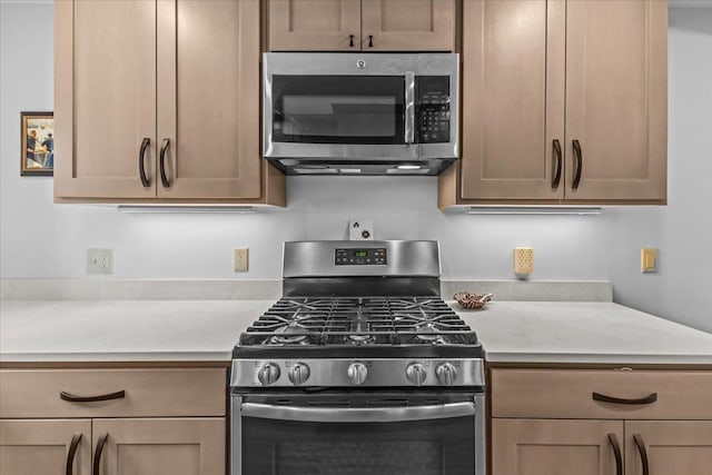 kitchen with light countertops and stainless steel appliances
