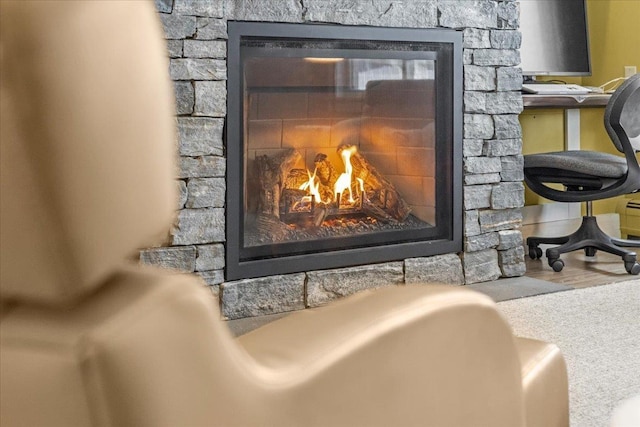 room details featuring a stone fireplace