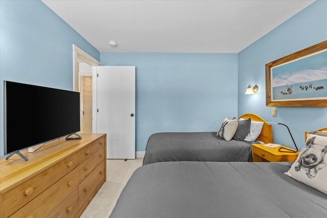 bedroom with light colored carpet